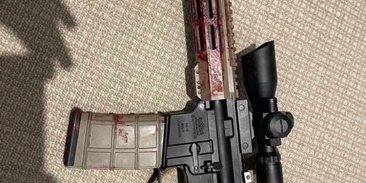 Blood-stained AR-15 rifle.