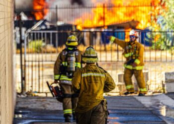 Firefighters battling a large fire.