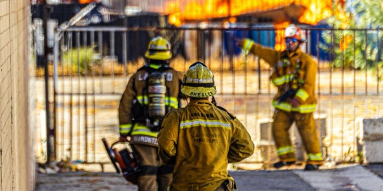 Firefighters battling a large fire.