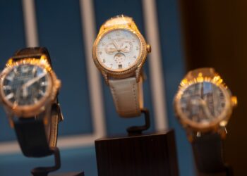 Three Patek Philippe watches on display.