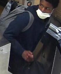 A masked stranger slashed a 29-year-old woman who refused to hand over her bag on board a train passing through Lower Manhattan, cops and sources said.