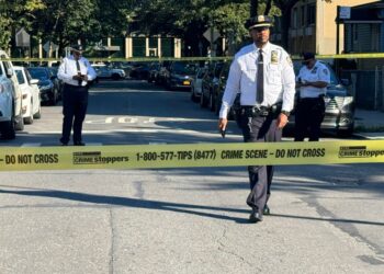 Police officers at a crime scene in the Bronx.