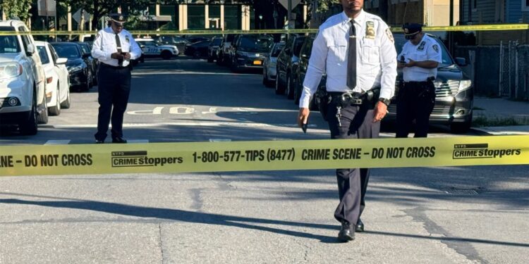 Police officers at a crime scene in the Bronx.