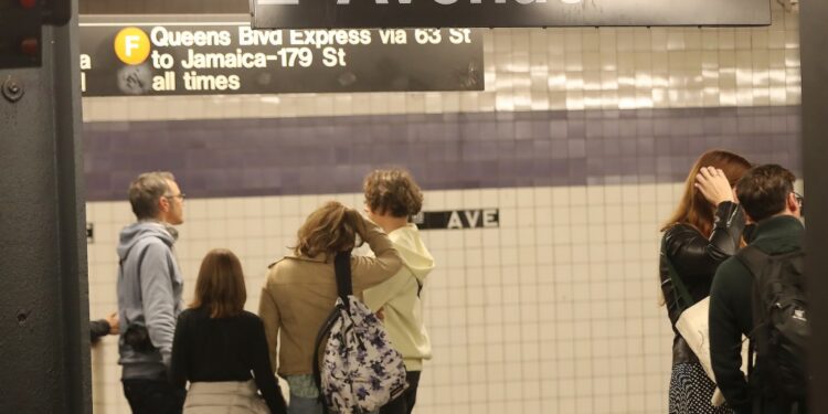 Subway riders wait for a train at the 2nd Avenue station in NY, NY on Oct. 20, 2024.