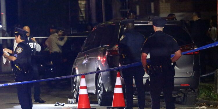 Police investigate a possible homicide scene in Queens, with blue police tape and orange cones visible.