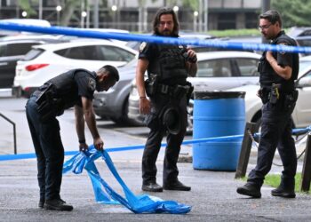 Police officers at a crime scene in Brooklyn.