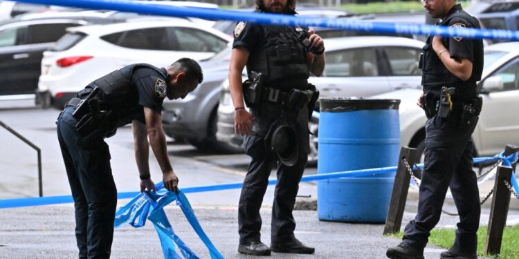 Police officers at a crime scene in Brooklyn.