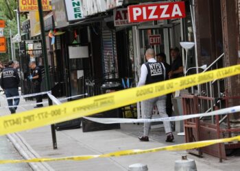 NYPD officers investigating a shooting on Clinton Street.