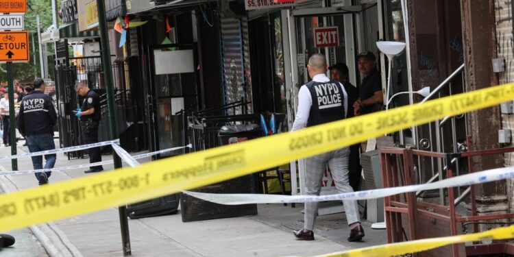 NYPD officers investigating a shooting on Clinton Street.