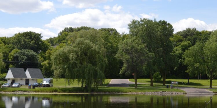 Keller Regional Park boat launch, buildings, and trees from across the water.