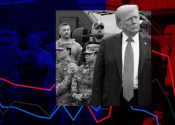 A photo illustration shows a black-and-white, red- and blue-tinted photo of President Donald Trump, a White man in his late 70s with light hair. Trump, wearing a suit and tie, looks to the side while standing in front of federal agents and police officers in uniform.  Red, blue and gray data lines run across the illustration.