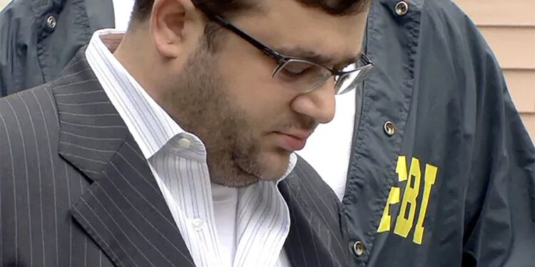 Eliyahu Weinstein being escorted by FBI agents.