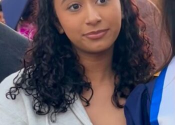 Celeste Rivas wearing a gray zipped hoodie.