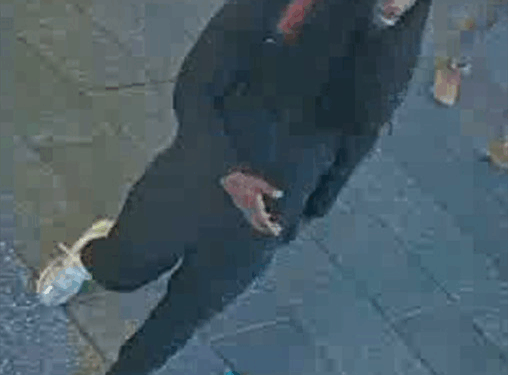 Surveillance image of an individual wanted in connection with an assault.