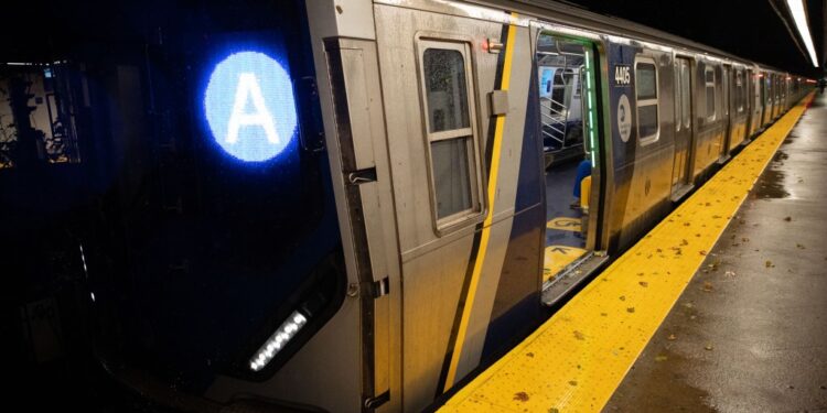 An A train is seen stopped in the Manhattan bound track at the Cohancy and N Conduit Ave. subway station in Queens, Monday, Oct. 13, 2025. A tree fell across the tracks at the next station briefly interrupting service while MTA workers removed it.